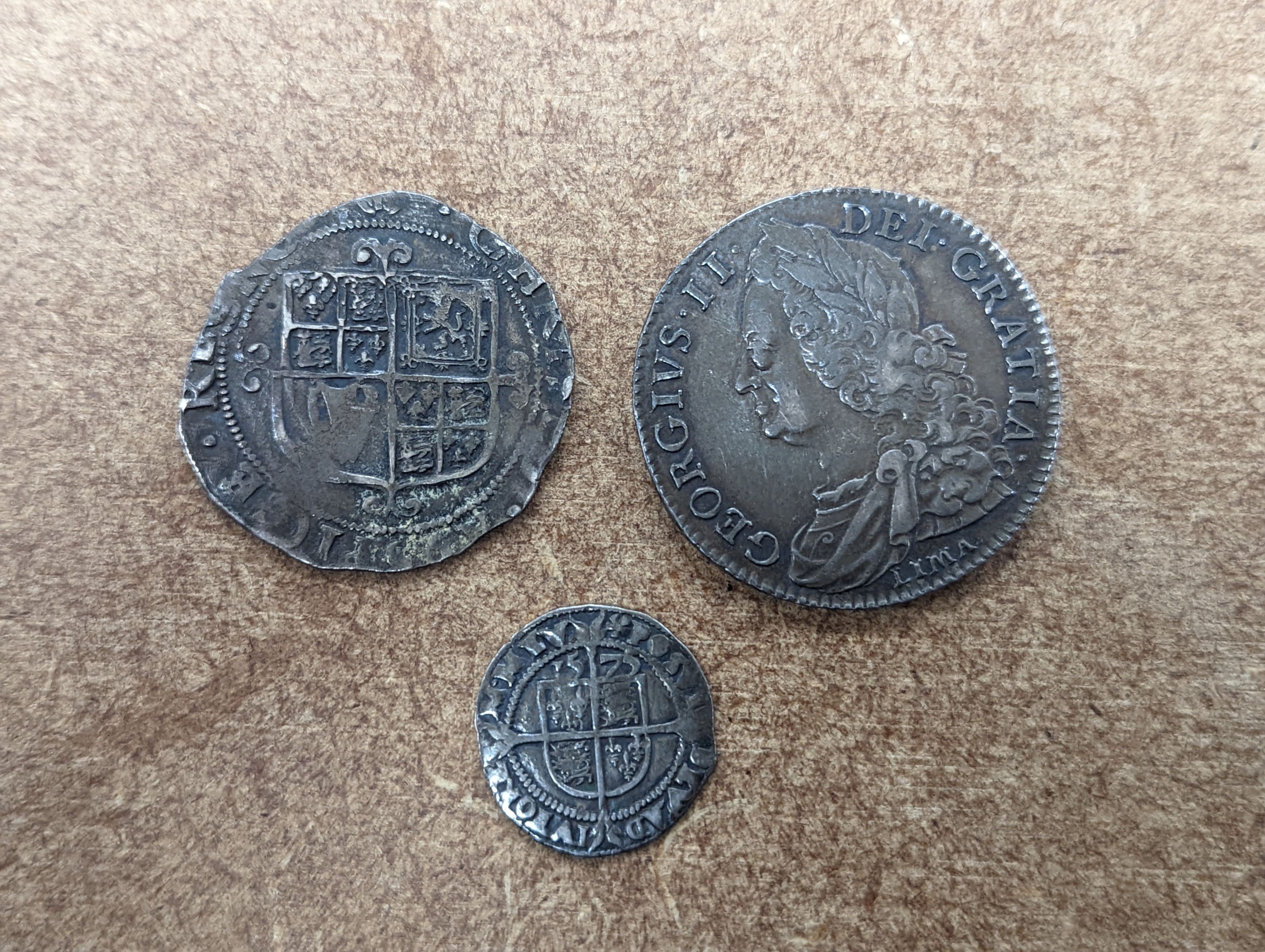 A George II half crown Lima 1746, good F, an Edward VII shilling, a Charles II shilling 1644, incomplete flange VG, and a Queen Elizabeth I threepence 1572, mm. Eglantine (4)